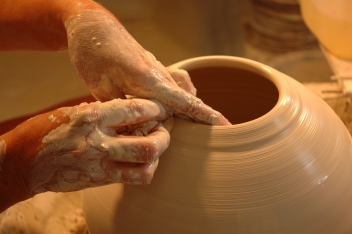 Potter's hands creating new ceramic vase © Irina Yun