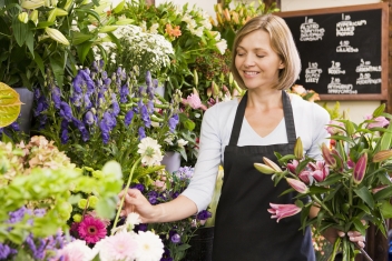 Woman working at flower shop smiling © Monkey Business #8525517